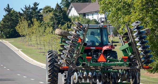 following farm equipment photo